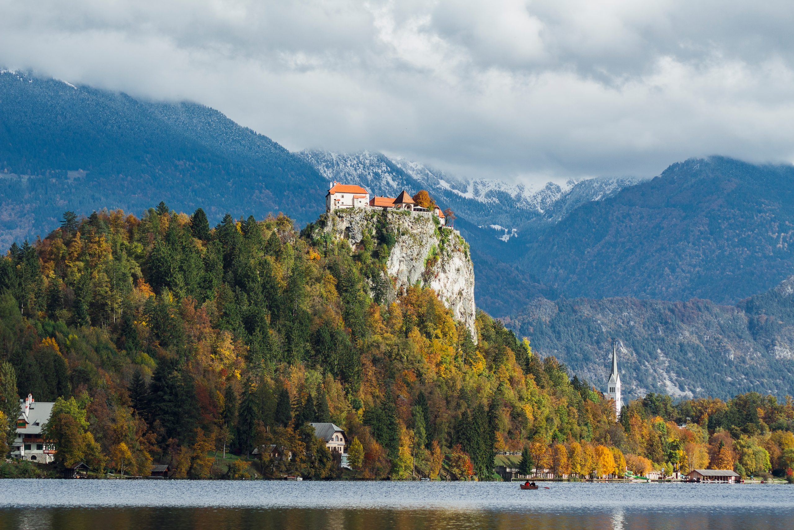 historic castle top hill covered with colorful leaves bled slovenia scaled 1.jpg